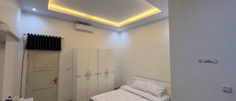 Deluxe Double Room, Courtyard View | Desk, laptop workspace, iron/ironing board, free WiFi