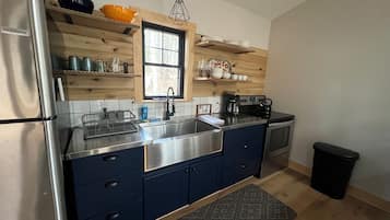 Fridge, oven, coffee/tea maker, cookware/dishes/utensils