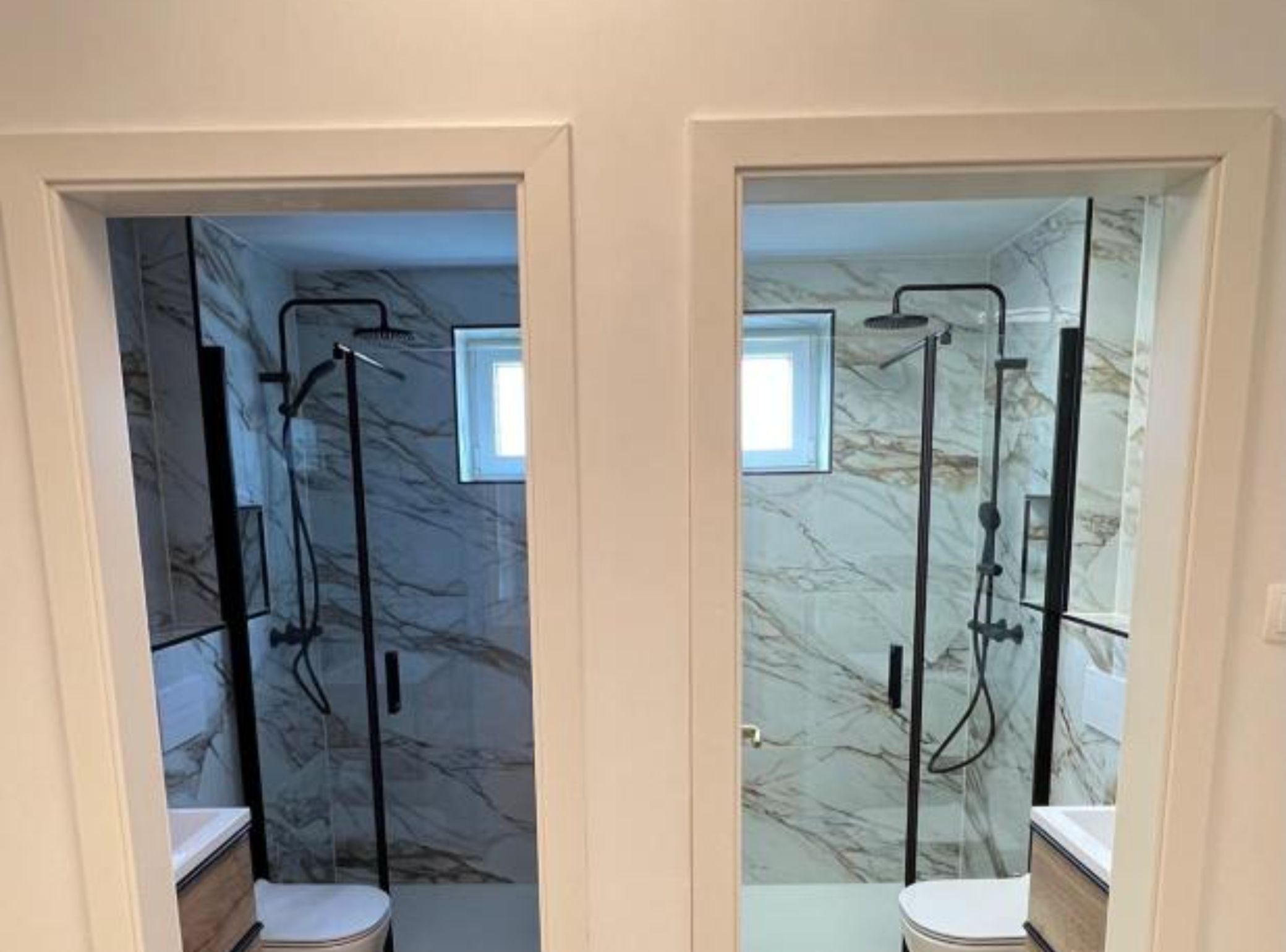 A bathroom with a glass-enclosed shower and a toilet.