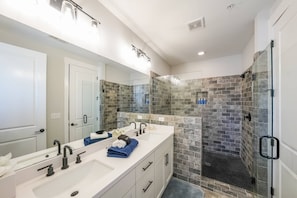 Shower, hair dryer, towels, shampoo