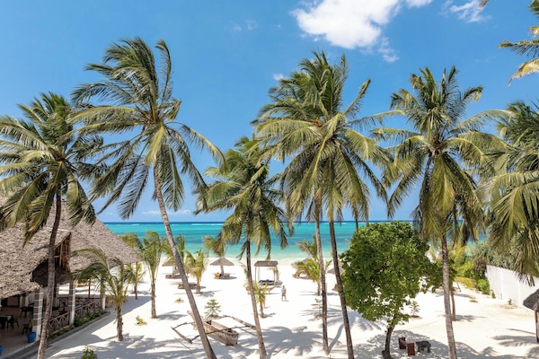 Private beach, white sand, sun loungers, beach umbrellas