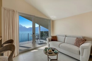 Family House, Multiple Bedrooms, Lakeside (Boutique apartment Venere with Pool) | Living area | 32-inch Smart TV with satellite channels - Villa Mercurio Apartments (Brenzone sul Garda)