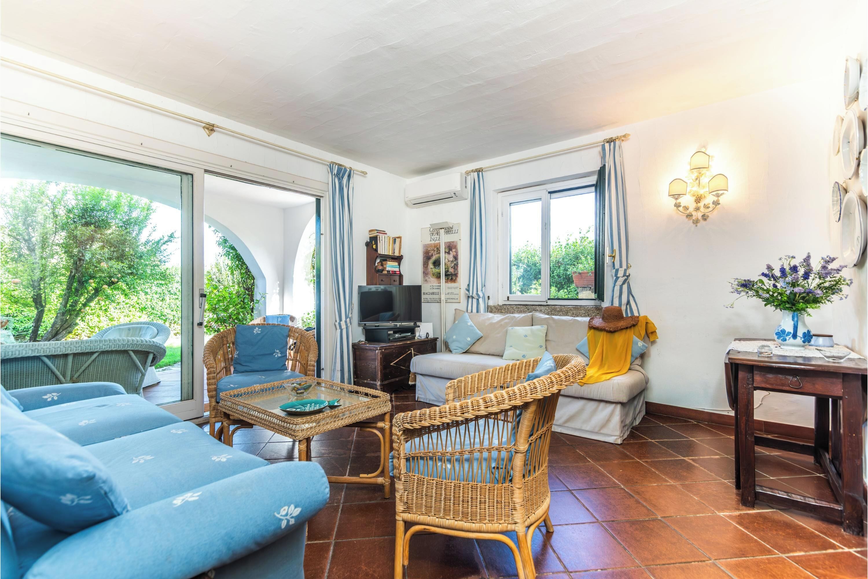 Family Apartment, Multiple Bedrooms (Number One With Shared Pool) | Living area | 32-inch Smart TV with satellite channels