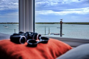 Enjoy the serene view of the water from the comfort of your room, with a window seat perfect for taking in the sights.
