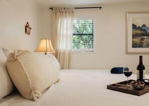 1 bedroom, desk, iron/ironing board, travel crib