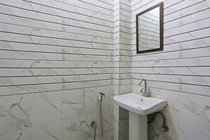 Deluxe Double Room | Bathroom | Combined shower/bathtub, free toiletries, towels, soap - Swastik residency by Twamev (New Delhi)