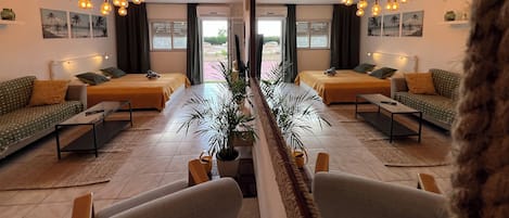 Romantic Studio, 1 Double Bed, Sea View, Poolside | Living area | 65-inch LED TV with digital channels