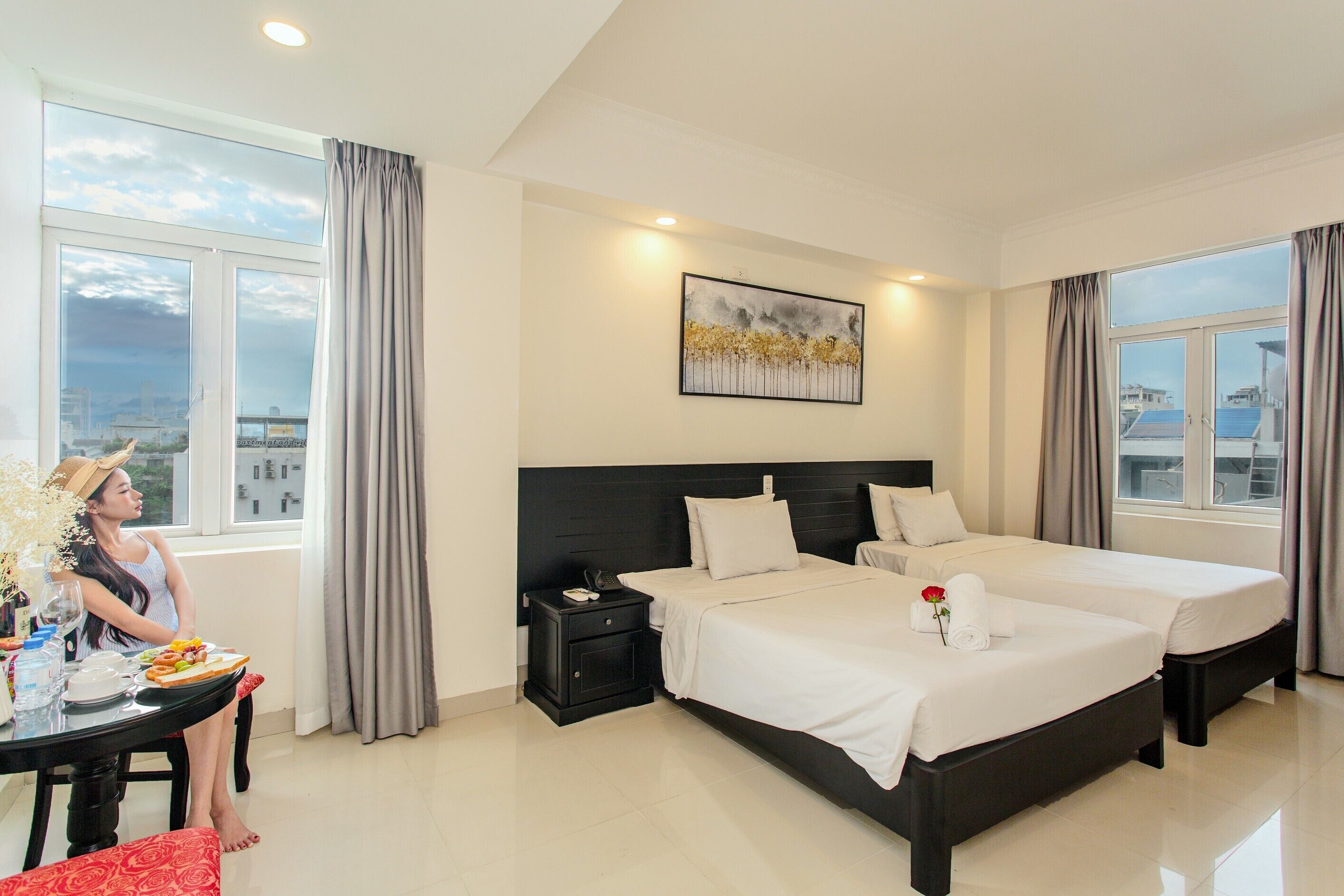 Deluxe Triple Room, City View | In-room safe, desk, laptop workspace, blackout drapes