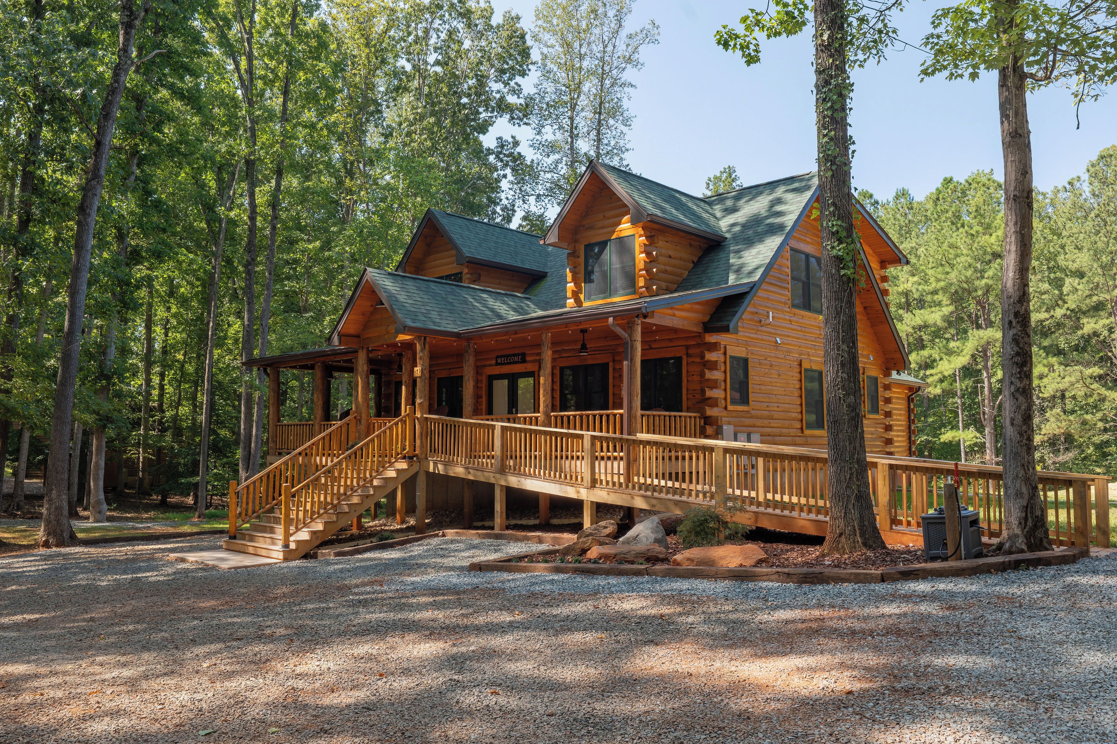 Hand peeled log posts and wide steps wait to greet you on All Decked Out’s massive outdoor living space. Tons of  high quality furniture, high velocity ceiling fans and lake views await. The interior is amazing, but outdoors is where you live here.