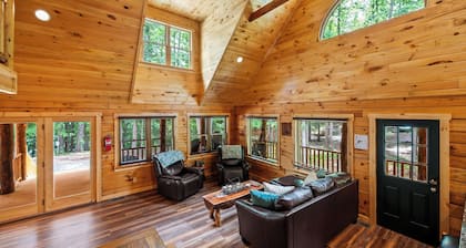 Stunning SML lakefront cabin: luxurious finishes, spacious rooms, wraparound deck, easy dock access. Family-friendly with toys, media room, serene views!