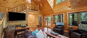 Stunning SML lakefront cabin: luxurious finishes, spacious rooms, wraparound deck, easy dock access. Family-friendly with toys, media room, serene views!