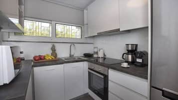 Comfort Apartment, 2 Bedrooms, Sea View | Private kitchen | Full-size fridge, oven, stovetop, coffee/tea maker