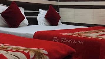 Desk, laptop workspace, bed sheets