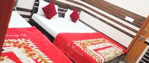 Desk, laptop workspace, bed sheets