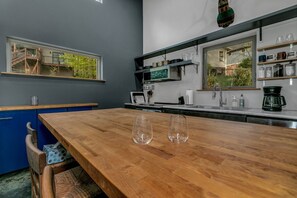 Dishwasher, toaster, spices, dining tables