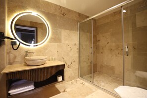 Suite, Balcony, City View | Bathroom | Hair dryer, slippers, towels, soap