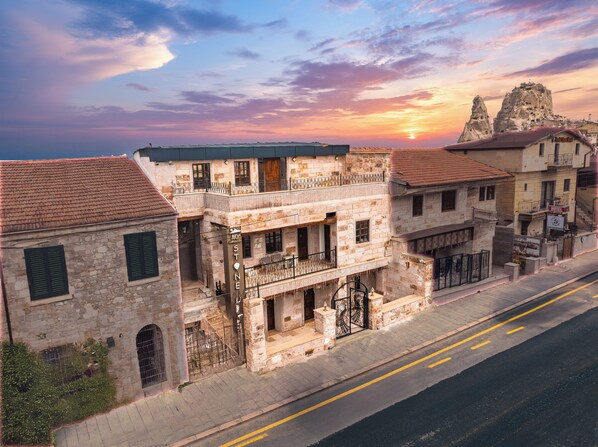 A stone building with a balcony, a sign reading 'MY STONE,' and a 'HOTEL' sign. - My Cappadocia Stone House (Nevsehir)