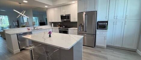 Microwave, stovetop, dishwasher, cookware/dishes/utensils