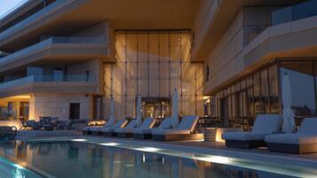 Indoor pool, outdoor pool, pool umbrellas, sun loungers