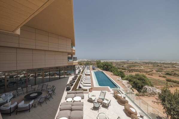 Indoor pool, outdoor pool, pool umbrellas, pool loungers