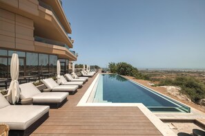 Indoor pool, outdoor pool, pool umbrellas, sun loungers