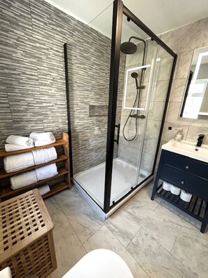 Shower, hair dryer, towels, soap