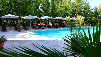 Seasonal outdoor pool, open 10:00 AM to 8:00 PM, pool umbrellas