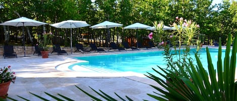 Seasonal outdoor pool, open 10:00 AM to 8:00 PM, pool umbrellas
