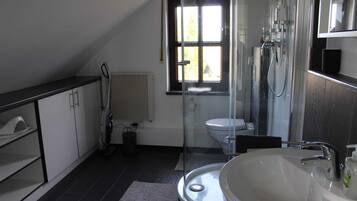 Shower, hair dryer, towels, soap