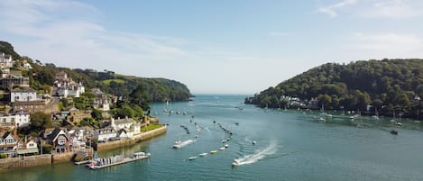 Experience the charm of a bustling coastal town with a vibrant marina and historic quay.