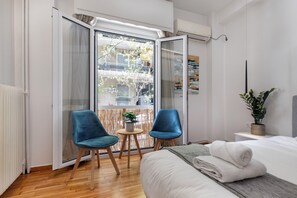 Premium bedding, desk, laptop workspace, iron/ironing board
