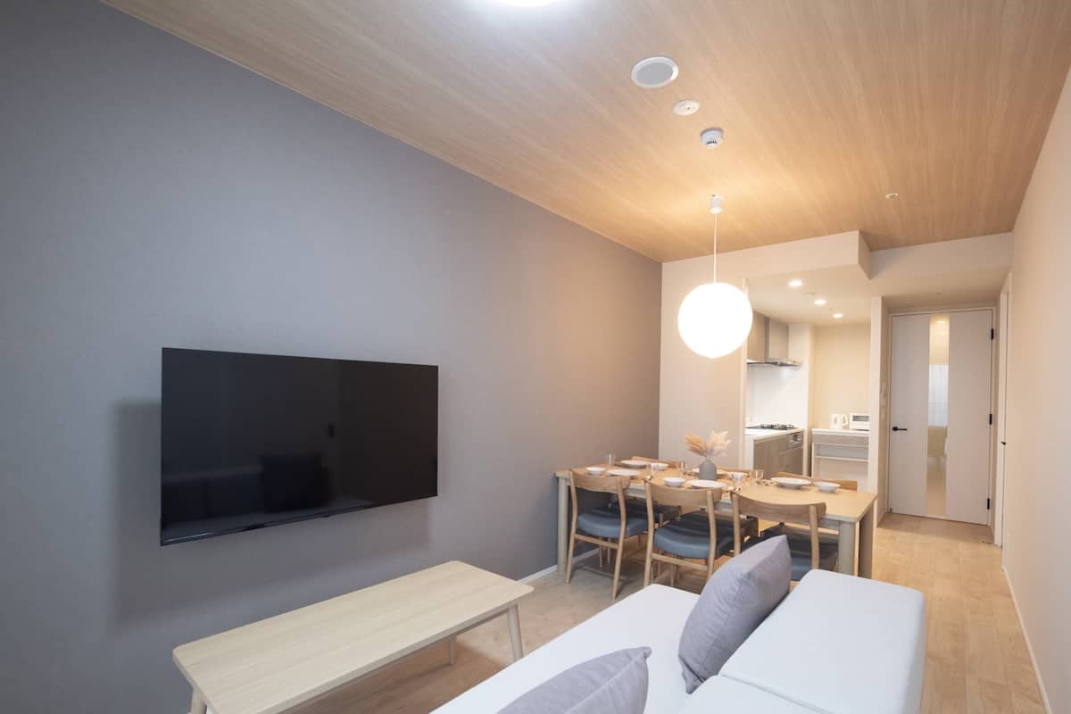 Apartment with 4 Beds (Maximum 5 people) - 10th-13th Floor Btype | Living room | 50-inch flat-screen TV with digital channels