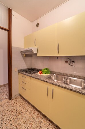 Fridge, microwave, coffee/tea maker, cookware/dishes/utensils