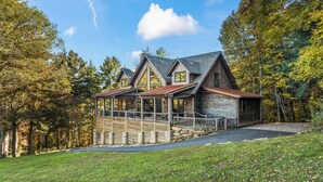 A wooden cabin with a porch, surrounded by trees. - Scenic Sanctuary w/ Mtn Views: Glenville Lodge (Glenville)