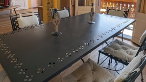 A dining area with a large table, chairs, and a chandelier. - Bright, family-friendly apartment just outside Villars! (Villars-sur-Ollon)