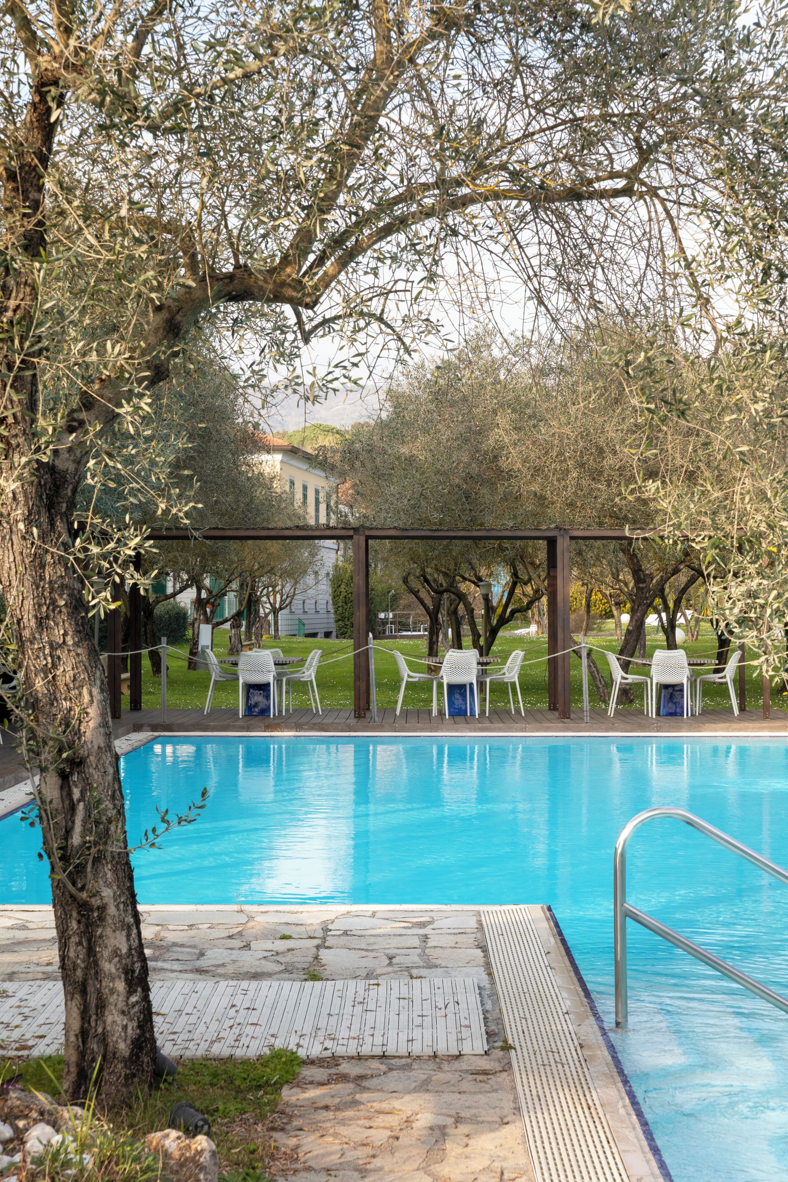 Seasonal outdoor pool, open 10:00 AM to 6:00 PM, pool umbrellas