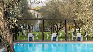 Seasonal outdoor pool, open 10:00 AM to 6:00 PM, pool umbrellas