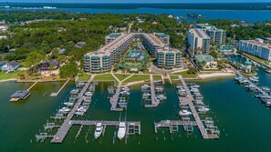 Enjoy ocean views from the hotel's multiple buildings with balconies, surrounded by lush greenery and a scenic marina.