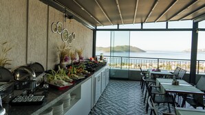 A buffet setup with a view of the sea. - Brow City Kaş (Kas)