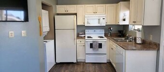 2 minute walk to the beach ~ 2 pools and a balcony-Sleeps 4