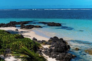 On the beach, sun loungers, beach towels