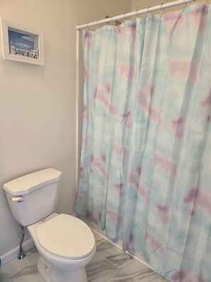 Shower, towels, soap, toilet paper