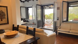 Villa, Sea View | Living area | 32-inch flat-screen TV with cable channels - Villetta Oasi Belvedere Budoni Wifi Ac (Baia Sant'Anna)