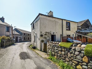 A narrow street with stone walls and traditional buildings. - 2 bedroom accommodation in Walney, near Barrow-in- Furness (Walney, near Barrow-in- Furness)