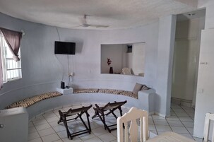 Villa | Living area | 140-inch TV with satellite channels