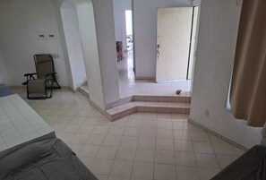 House | Living area | 140-inch TV with satellite channels