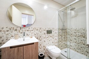 Shower, hair dryer, towels, soap
