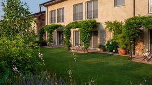 A building with a garden and a patio area.