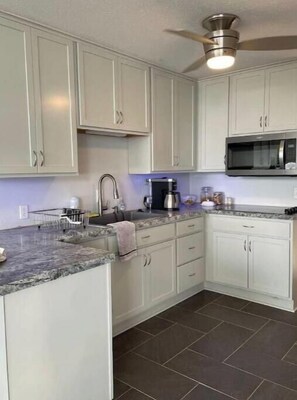 Fridge, microwave, stovetop, coffee/tea maker