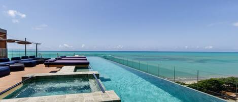 Outdoor pool, open 8:00 AM to 7:00 PM, pool loungers
